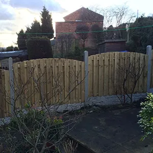 a wooden fence in front of a house