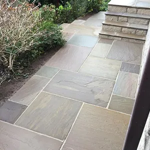 A stone walkway with steps leading up to it.